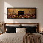 A panoramic painting of the Kaaba standing at the center of a vibrant field of colorful flowers with red, pink, yellow, and white blossoms stretching across the foreground, set against a glowing gold textured background with faint mosque silhouettes and minarets surrounding the sacred structure.