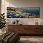 A panoramic coastal landscape painting showing blue and white wildflowers blooming along a grassy cliff overlooking a rocky shoreline and deep blue ocean waves, with distant mountains and scattered sea stacks beneath a bright sky stretching across the wide horizontal composition.