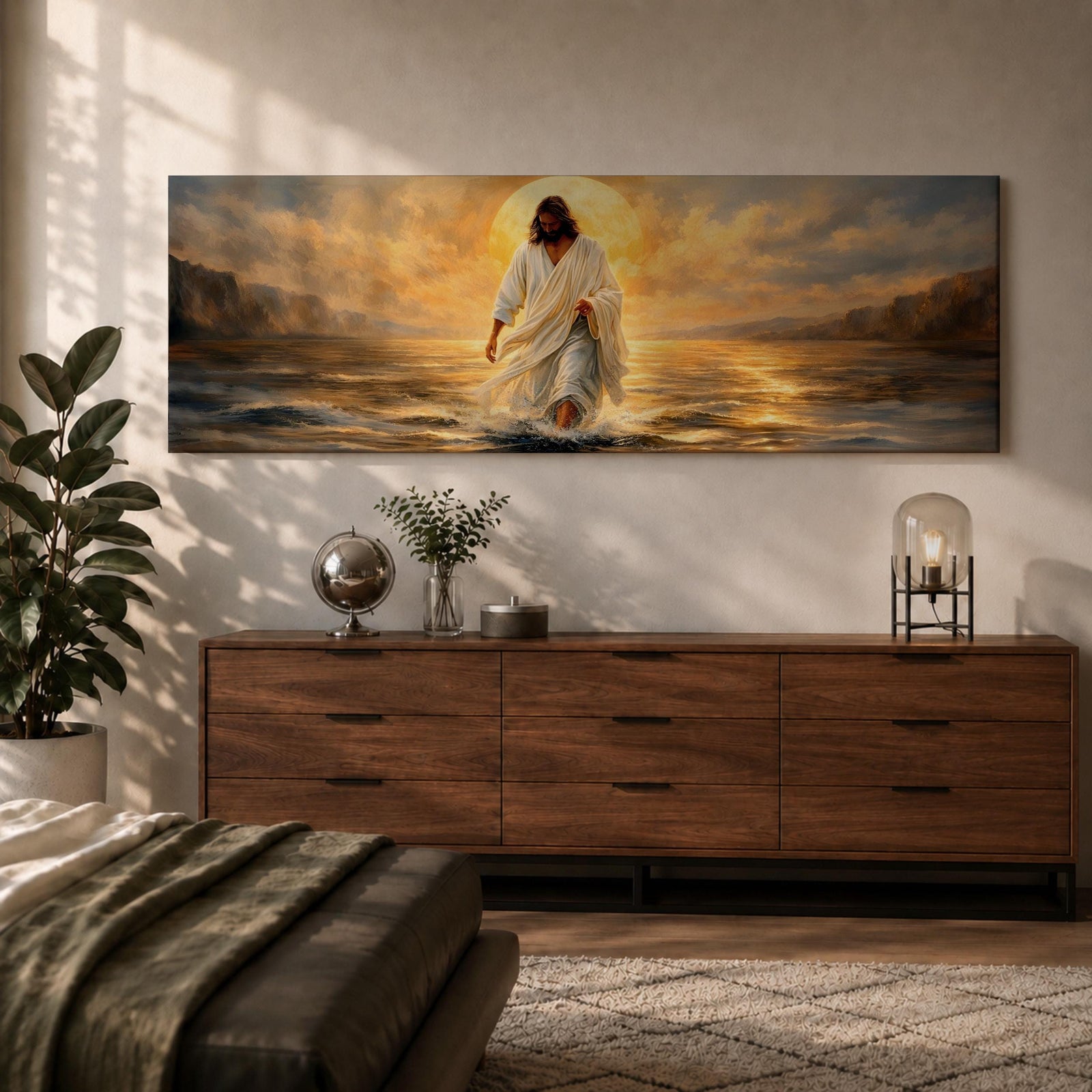 A panoramic painting of Jesus walking across the surface of the sea beneath a glowing golden sunset, his flowing white robes illuminated by radiant light as waves ripple around his feet while distant mountains and dramatic clouds frame the horizon.