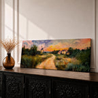 A panoramic countryside landscape painting showing a winding dirt road leading through grassy fields toward a traditional windmill and small farmhouse under a glowing sunset sky, with soft clouds and warm golden light illuminating the rural scenery across the wide composition.