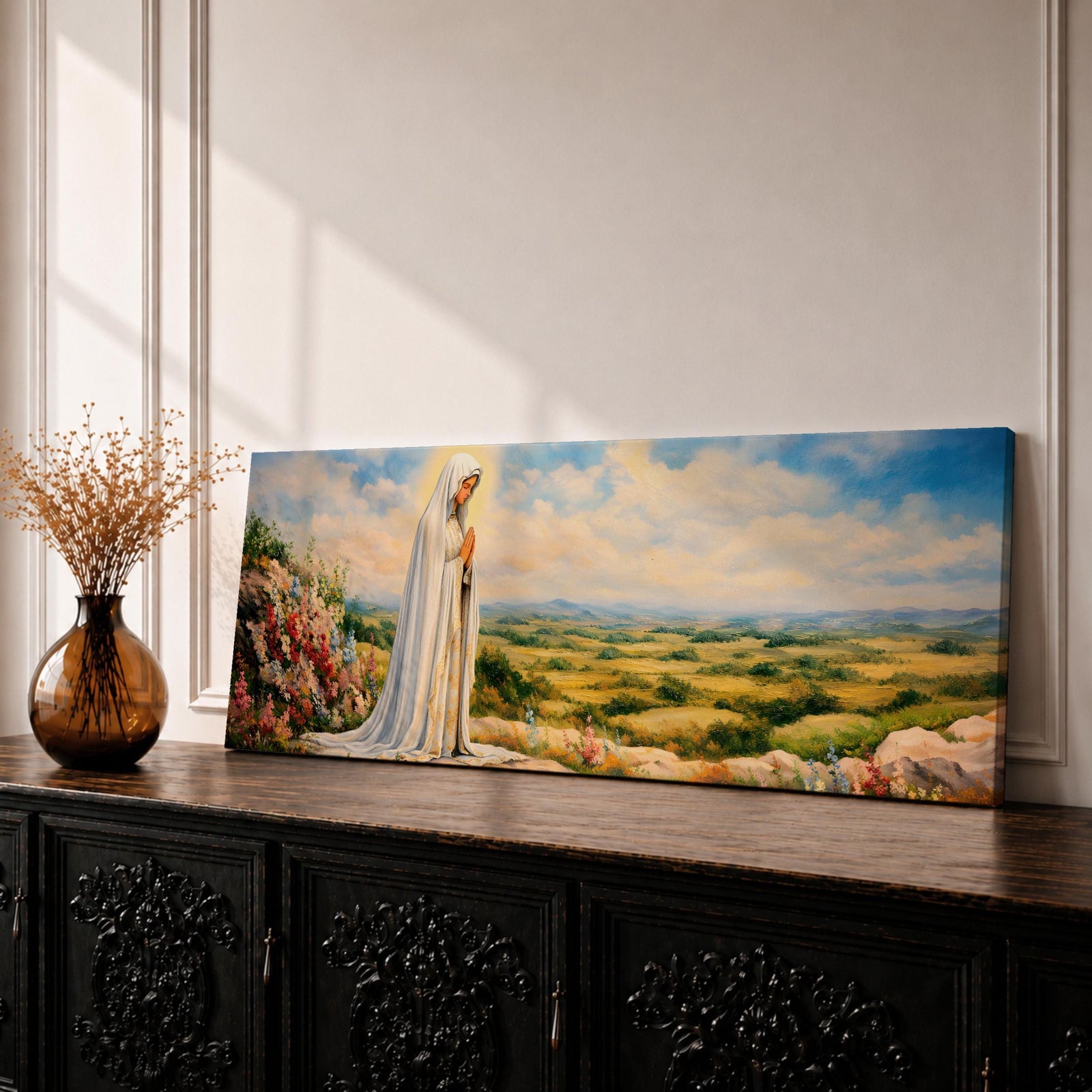 Panoramic painting of the Virgin Mary, the Blessed Mother, standing in prayer on a hillside with colorful flowers overlooking a peaceful countryside landscape beneath a soft blue sky.