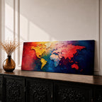A long horizontal panoramic canvas displaying a textured abstract world map with continents formed using thick palette knife strokes. Warm tones of red, orange, and yellow shape the Americas while Europe and Africa appear in lighter hues, and Asia and Australia glow in deep reds against rich blue oceans in a modern atlas style composition.