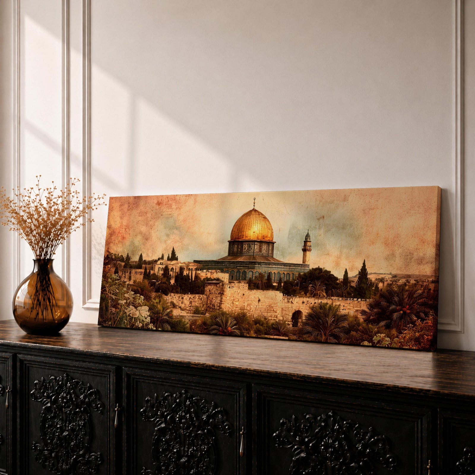 A long panoramic artwork depicting the Dome of the Rock in Jerusalem with its golden dome rising above historic stone walls and surrounding architecture. Palm trees and greenery frame the foreground while warm vintage tones and textured sky create a historic Middle Eastern cityscape centered on the iconic Islamic shrine.