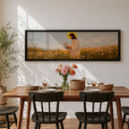 A long panoramic painting of Jesus standing in a wildflower meadow holding delicate pink flowers, wearing a flowing white robe with a golden halo behind his head. Tall grasses and blooming flowers stretch across the landscape under a soft sky, creating a peaceful Christian scene centered on Christ in nature.