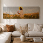 A long panoramic painting of Jesus standing in a wildflower meadow holding delicate pink flowers, wearing a flowing white robe with a golden halo behind his head. Tall grasses and blooming flowers stretch across the landscape under a soft sky, creating a peaceful Christian scene centered on Christ in nature.