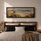 A long panoramic coastal painting showing sandy dunes covered with wild grasses and small white flowers overlooking a calm ocean shoreline. Soft waves roll toward the beach beneath a pale blue sky while textured brush strokes create a peaceful seascape landscape stretching across a wide horizontal composition.