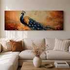 A long panoramic painting of a vibrant peacock standing in an autumn landscape with its long blue and gold tail feathers flowing across the composition. The bird displays detailed eye patterned plumage while warm sunset tones and delicate foliage create a serene nature scene in a wide horizontal format.