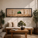 A long panoramic painting of the Green Dome of Masjid Nabawi in Medina rising above elegant mosque arches and courtyards. Tall slender minarets frame the sacred structure while soft beige and golden tones create a historic Islamic architectural scene centered on the iconic green dome in a wide horizontal composition.