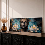 A long panoramic painting featuring a serene Buddha face with closed eyes centered between two blooming white lotus flowers. Rich textured tones of teal, black and gold surround the figure while the lotus blossoms frame the composition, creating a calm meditative Buddhist scene across a wide horizontal canvas.