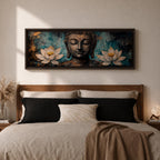A long panoramic painting featuring a serene Buddha face with closed eyes centered between two blooming white lotus flowers. Rich textured tones of teal, black and gold surround the figure while the lotus blossoms frame the composition, creating a calm meditative Buddhist scene across a wide horizontal canvas.