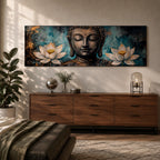 A long panoramic painting featuring a serene Buddha face with closed eyes centered between two blooming white lotus flowers. Rich textured tones of teal, black and gold surround the figure while the lotus blossoms frame the composition, creating a calm meditative Buddhist scene across a wide horizontal canvas.