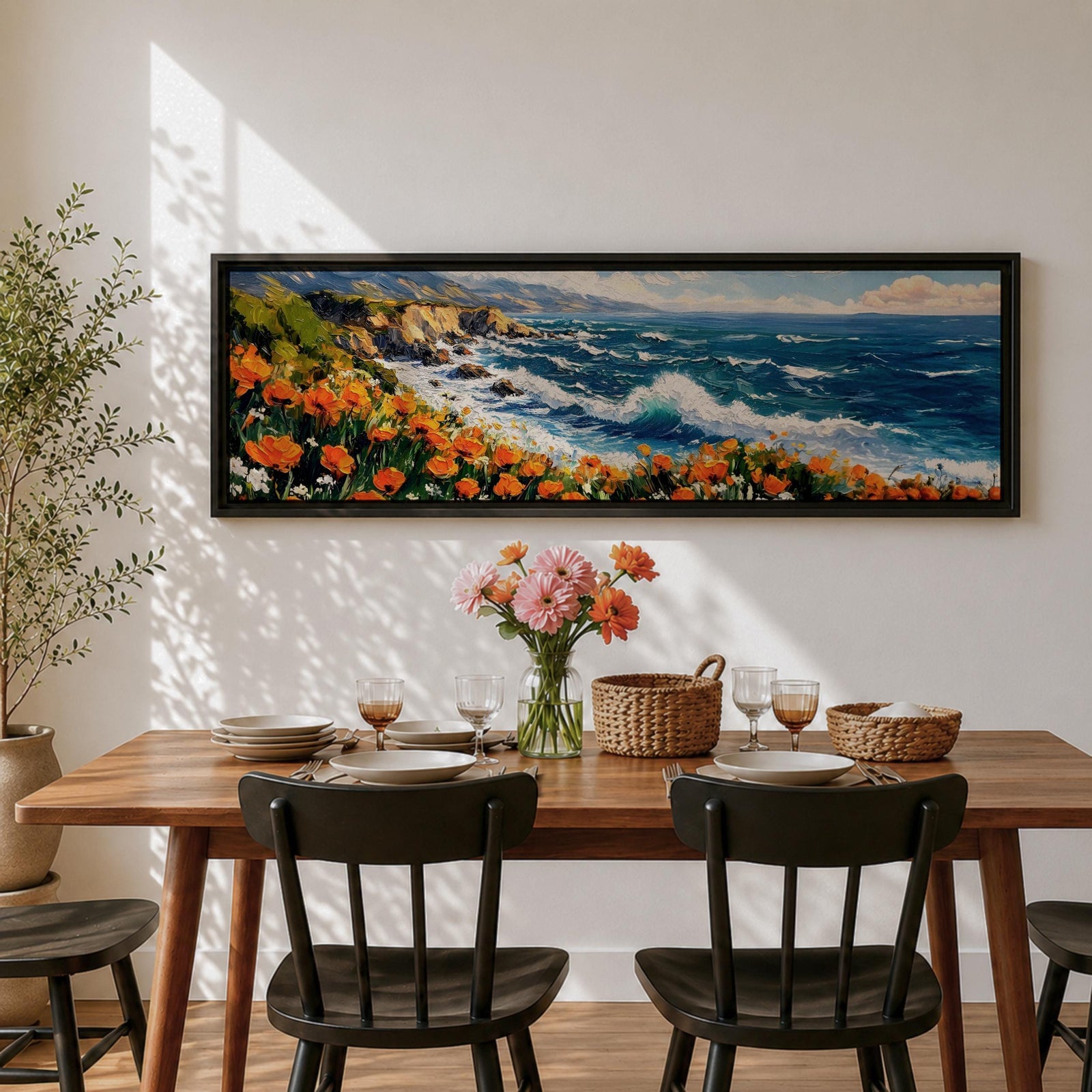 A long panoramic coastal painting showing ocean waves crashing against rocky cliffs while bright orange wildflowers bloom along the shoreline. Deep blue water and white sea foam move toward the coast beneath a clear sky, creating a vibrant seascape landscape in a wide horizontal composition.