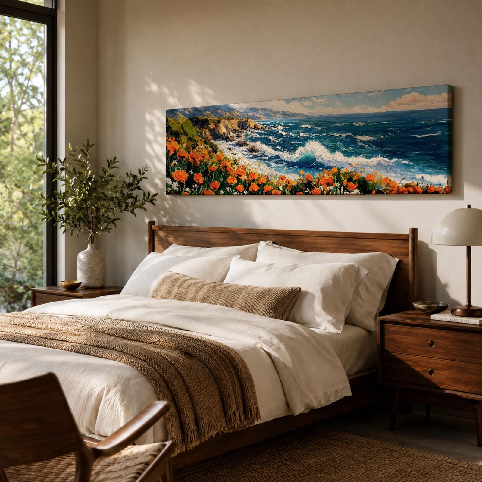 A long panoramic coastal painting showing ocean waves crashing against rocky cliffs while bright orange wildflowers bloom along the shoreline. Deep blue water and white sea foam move toward the coast beneath a clear sky, creating a vibrant seascape landscape in a wide horizontal composition.
