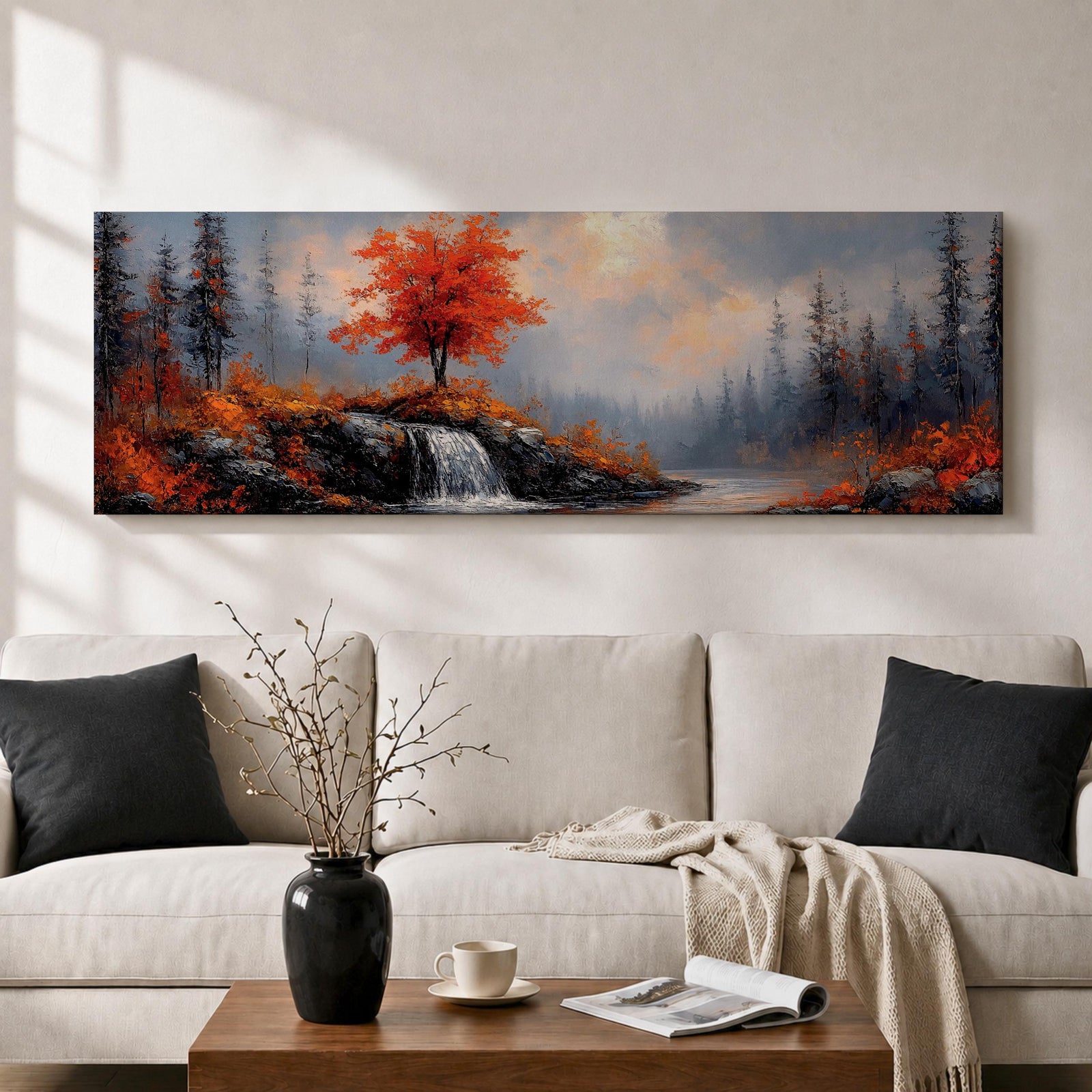 A long panoramic landscape painting showing a small waterfall flowing over rocky cliffs beneath a vivid red autumn tree. Surrounding forest trees fade into misty blue tones while bright fall foliage and rugged stones frame the stream, forming a tranquil woodland scene across a wide horizontal composition.