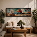 A long panoramic mosaic style artwork depicting the Al Aqsa compound in Jerusalem with the golden Dome of the Rock rising above historic stone walls and surrounding architecture. The scene is built from colorful geometric tiles and textured blocks, creating a vibrant Islamic cityscape across a wide horizontal composition.