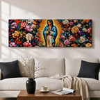 A long panoramic painting of Mary of Guadalupe standing in prayer with hands folded and head bowed, surrounded by radiant golden rays. She wears a blue mantle over a rose colored gown while vibrant roses and colorful flowers fill the background, creating a devotional Catholic Marian image across a wide horizontal composition.
