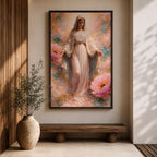 A framed canvas painting depicting the Immaculate Conception showing the Virgin Mary standing with open arms surrounded by soft pink flowers and golden accents, rendered in a realistic style with delicate flowing robes and a serene expression.