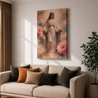 A framed canvas painting depicting the Immaculate Conception showing the Virgin Mary standing with open arms surrounded by soft pink flowers and golden accents, rendered in a realistic style with delicate flowing robes and a serene expression.