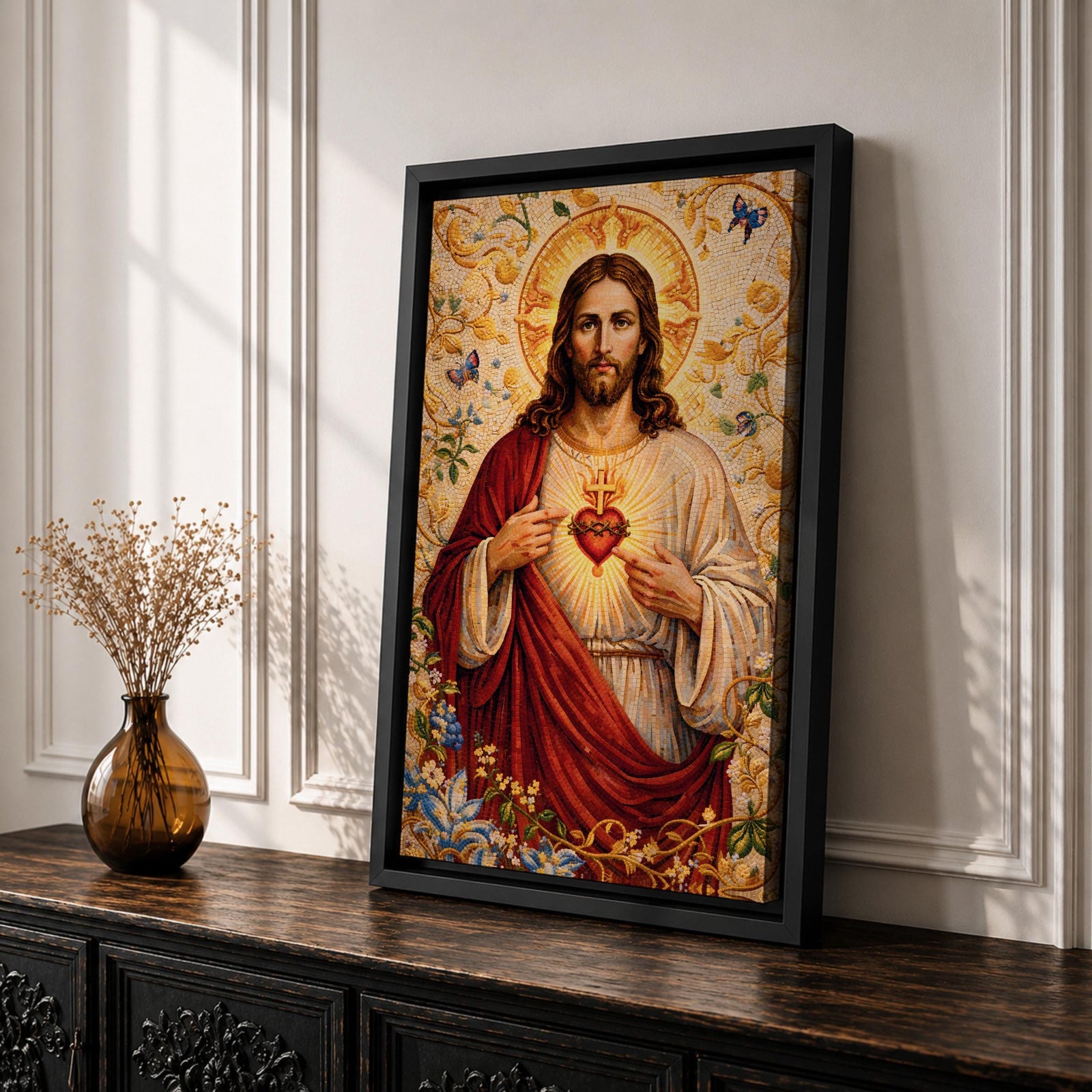 A detailed mosaic-style artwork depicting the Sacred Heart of Jesus with a glowing heart encircled by thorns and a cross above it. Jesus is shown with long hair and a beard, wearing a red and white robe, surrounded by floral and butterfly motifs in a radiant golden background.