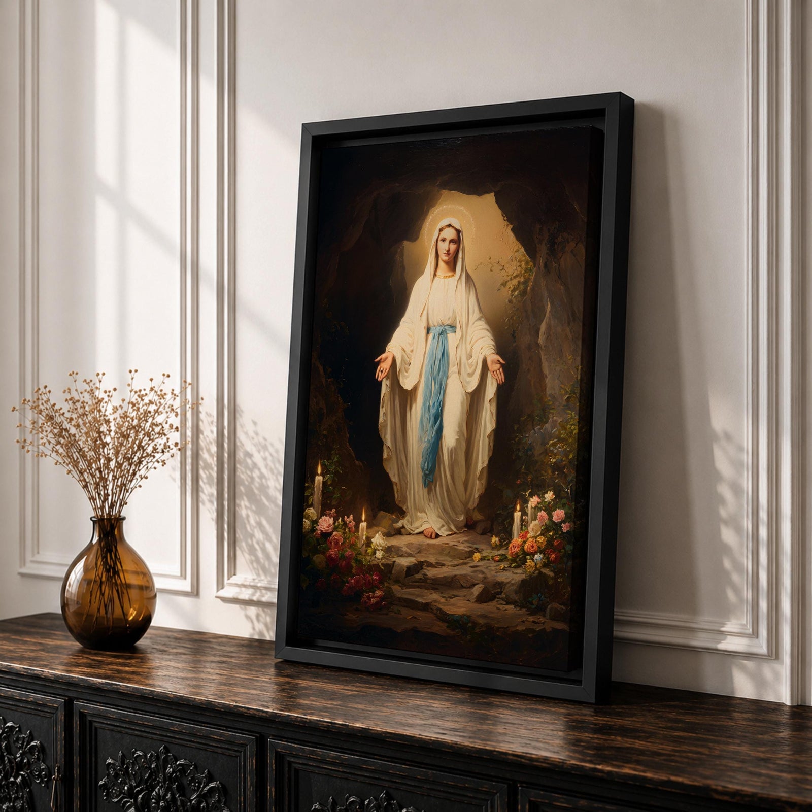 A detailed painting of Our Lady of Lourdes standing at the entrance of a grotto with open arms, dressed in white robes with a blue sash, surrounded by candles and flowers, representing the Marian apparition at Lourdes in a traditional religious style.