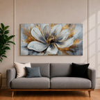 A panoramic abstract painting of a large white flower in full bloom, featuring layered petals with soft gray shading and a detailed textured center, accented by expressive gold brushstrokes that radiate outward, creating depth and contrast across a modern extra wide floral composition.