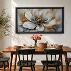 A panoramic abstract painting of a large white flower in full bloom, featuring layered petals with soft gray shading and a detailed textured center, accented by expressive gold brushstrokes that radiate outward, creating depth and contrast across a modern extra wide floral composition.