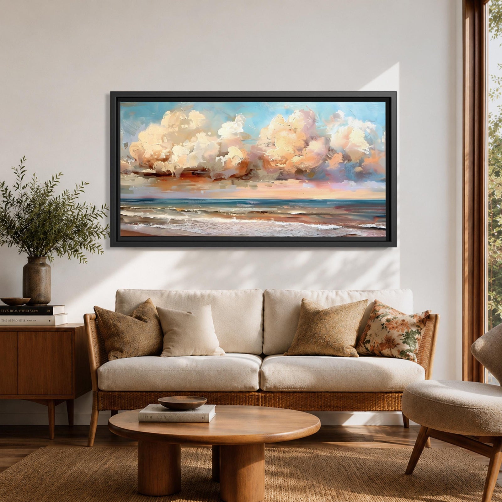 A panoramic impressionist seascape painting of ocean waves rolling onto shore beneath a vast sky filled with large dramatic clouds in soft peach, cream, and blue tones, with textured brushstrokes capturing light reflecting across the water and horizon, creating a serene yet dynamic coastal atmosphere.