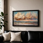 A panoramic impressionist seascape painting of ocean waves rolling onto shore beneath a vast sky filled with large dramatic clouds in soft peach, cream, and blue tones, with textured brushstrokes capturing light reflecting across the water and horizon, creating a serene yet dynamic coastal atmosphere.