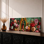 A long narrow panoramic painting shows Virgen de Guadalupe centered in prayer within a radiant halo, surrounded by richly detailed blooming flowers, with textured abstract layers and deep earthy tones blending with vibrant florals to create depth, contrast, and a luminous devotional focal point in an expressive style.