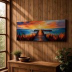 A long narrow panoramic painting depicts a wooden pier extending through tall grasses into calm ocean waters, leading toward a glowing sunset on the horizon, with bold textured brushstrokes and vivid color contrasts capturing reflections of warm light across the water and sky in an expressive contemporary style.
