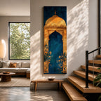 A tall vertical artwork depicting a stylized mihrab with a golden domed top and ornate arch framing a deep blue interior, accented with delicate floral motifs along the base, combining traditional Islamic architectural elements with a refined painterly style and strong vertical symmetry