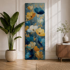 A tall, narrow vertical painting of stylized poppy flowers in layered teal, navy, gold, and soft white tones, featuring textured brushstrokes and metallic accents, with blooms rising along slender stems against a deep blue abstract background, creating a contemporary floral composition with rich contrast and flowing movement.