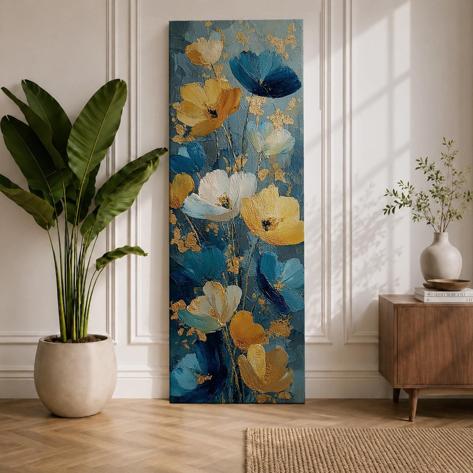 A tall, narrow vertical painting of stylized poppy flowers in layered teal, navy, gold, and soft white tones, featuring textured brushstrokes and metallic accents, with blooms rising along slender stems against a deep blue abstract background, creating a contemporary floral composition with rich contrast and flowing movement.