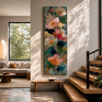 A tall, narrow vertical painting of soft pastel poppy flowers in shades of blush pink, coral, cream, and muted yellow, layered with textured brushstrokes and accented by hints of gold against a cool blue abstract background, with delicate stems and leaves creating a balanced contemporary floral composition.
