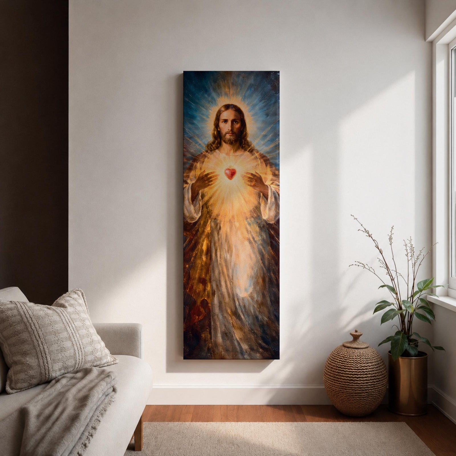 A tall vertical painting depicts Jesus Christ with a serene expression, long flowing hair, and a radiant halo, holding a glowing sacred heart at his chest that emits beams of golden light, rendered in warm tones with soft brushwork and luminous effects that create a spiritual and symbolic religious composition.