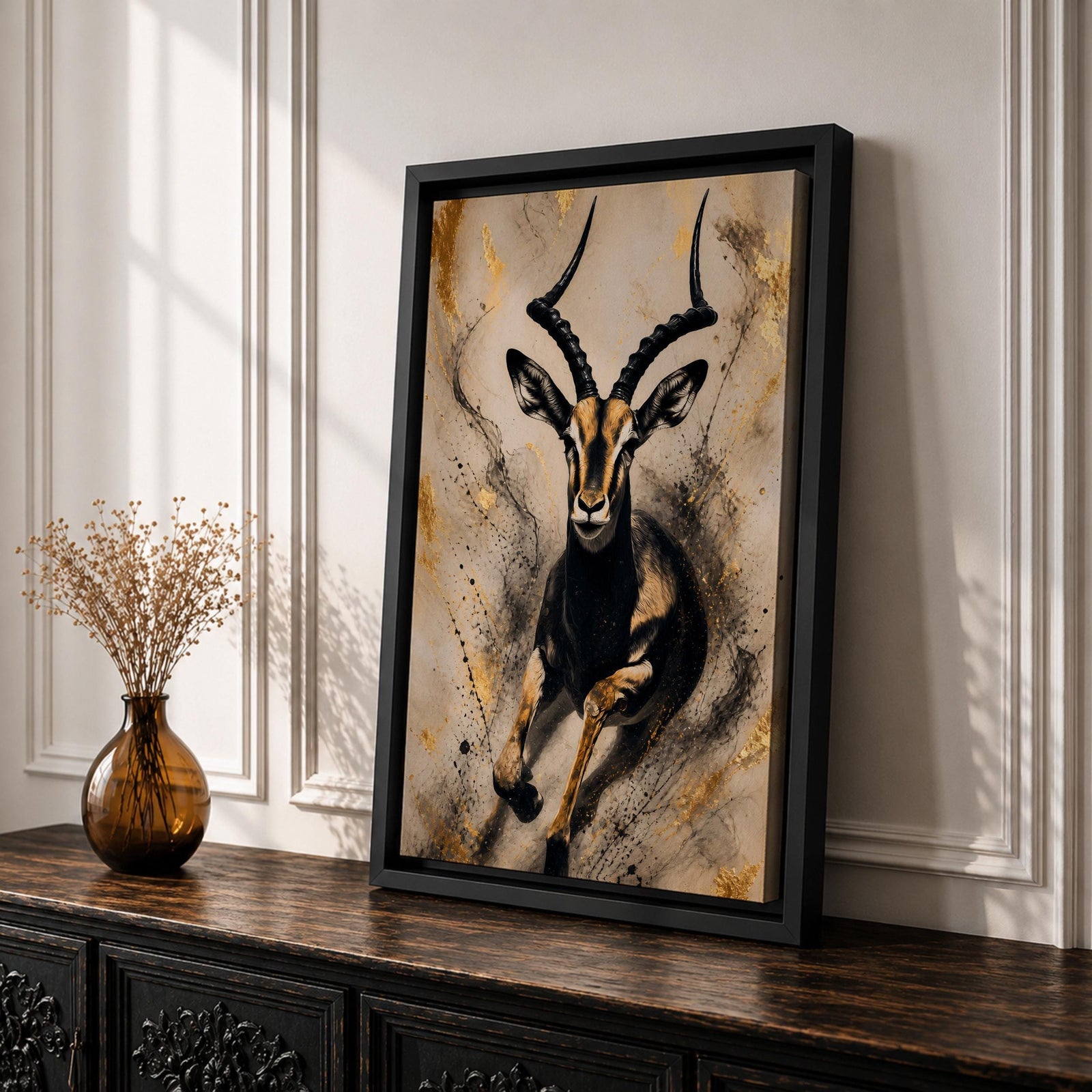 Striking gazelle wall art featuring a graceful antelope in motion with elegant curved horns against a contemporary abstract background. Wildlife artwork with dramatic black and gold tones, expressive splatter details, and luxurious gold accents, perfect for modern, safari, and nature-inspired interiors.
