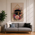 Elegant Kaaba wall art featuring the Holy Kaaba surrounded by blooming pink, blush, purple, and ivory flowers with delicate Islamic arch details. Soft watercolor tones and gold accents create a beautiful Islamic canvas artwork perfect for prayer rooms, bedrooms, and Muslim home decor.