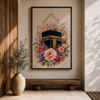 Elegant Kaaba wall art featuring the Holy Kaaba surrounded by blooming pink, blush, purple, and ivory flowers with delicate Islamic arch details. Soft watercolor tones and gold accents create a beautiful Islamic canvas artwork perfect for prayer rooms, bedrooms, and Muslim home decor.
