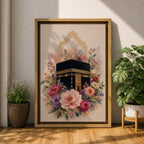 Elegant Kaaba wall art featuring the Holy Kaaba surrounded by blooming pink, blush, purple, and ivory flowers with delicate Islamic arch details. Soft watercolor tones and gold accents create a beautiful Islamic canvas artwork perfect for prayer rooms, bedrooms, and Muslim home decor.