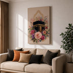 Elegant Kaaba wall art featuring the Holy Kaaba surrounded by blooming pink, blush, purple, and ivory flowers with delicate Islamic arch details. Soft watercolor tones and gold accents create a beautiful Islamic canvas artwork perfect for prayer rooms, bedrooms, and Muslim home decor.