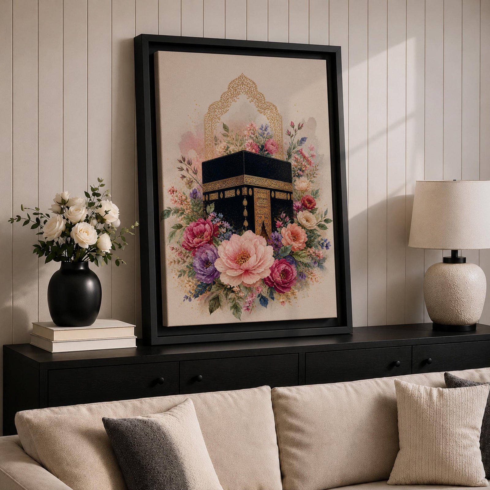 Elegant Kaaba wall art featuring the Holy Kaaba surrounded by blooming pink, blush, purple, and ivory flowers with delicate Islamic arch details. Soft watercolor tones and gold accents create a beautiful Islamic canvas artwork perfect for prayer rooms, bedrooms, and Muslim home decor.