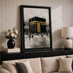 Elegant Kaaba wall art featuring the Holy Kaaba adorned with gold detailing, surrounded by worshippers in a textured abstract composition. Neutral black, gold, and ivory tones create a sophisticated Islamic canvas perfect for prayer rooms, living spaces, and Muslim home decor.