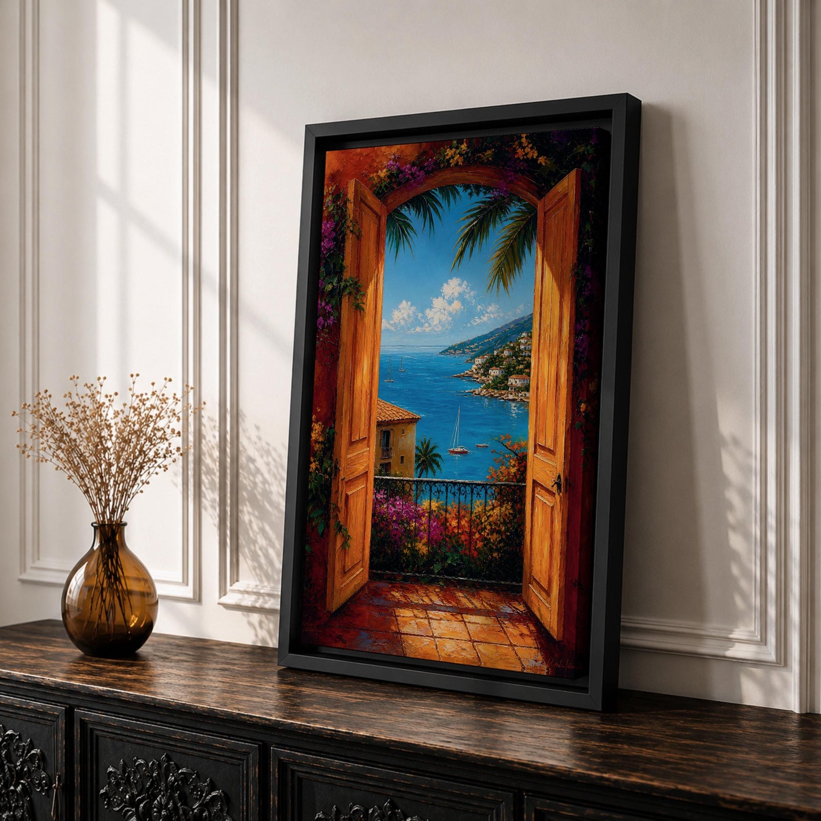 Mediterranean coastal landscape viewed through open wooden doors overlooking a bright blue sea. Colorful flowers, palm trees, sailboats, and hillside villas create a romantic Italian seaside scene in a vibrant impressionist framed canvas artwork.