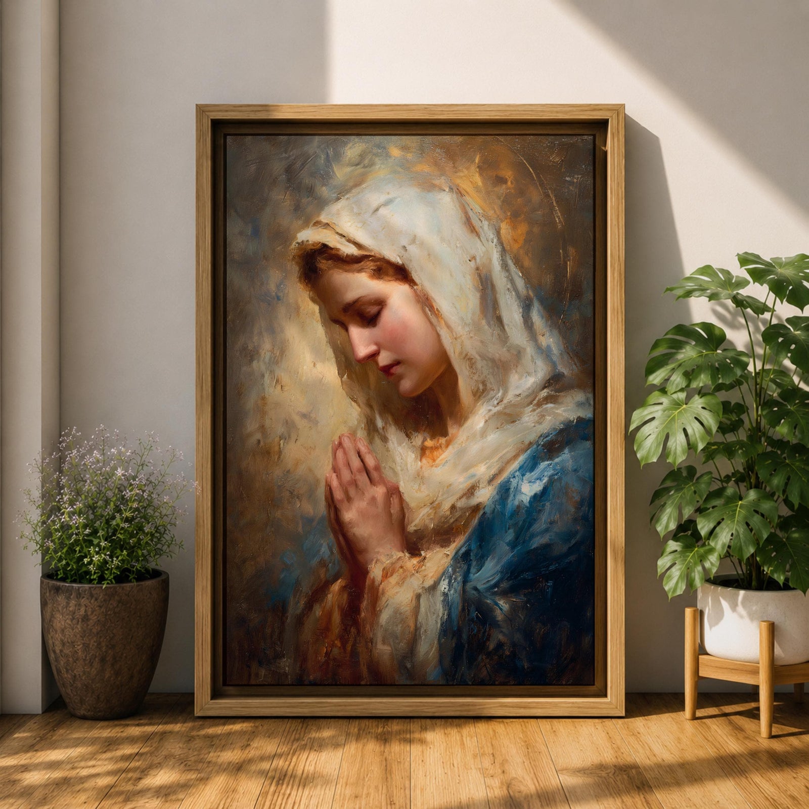 Sacred Catholic wall art featuring the Virgin Mary in prayer with hands clasped and eyes gently lowered. Soft golden light illuminates her serene expression, while rich blue garments and impressionist brushwork create a timeless devotional portrait ideal for prayer rooms and Christian homes.
