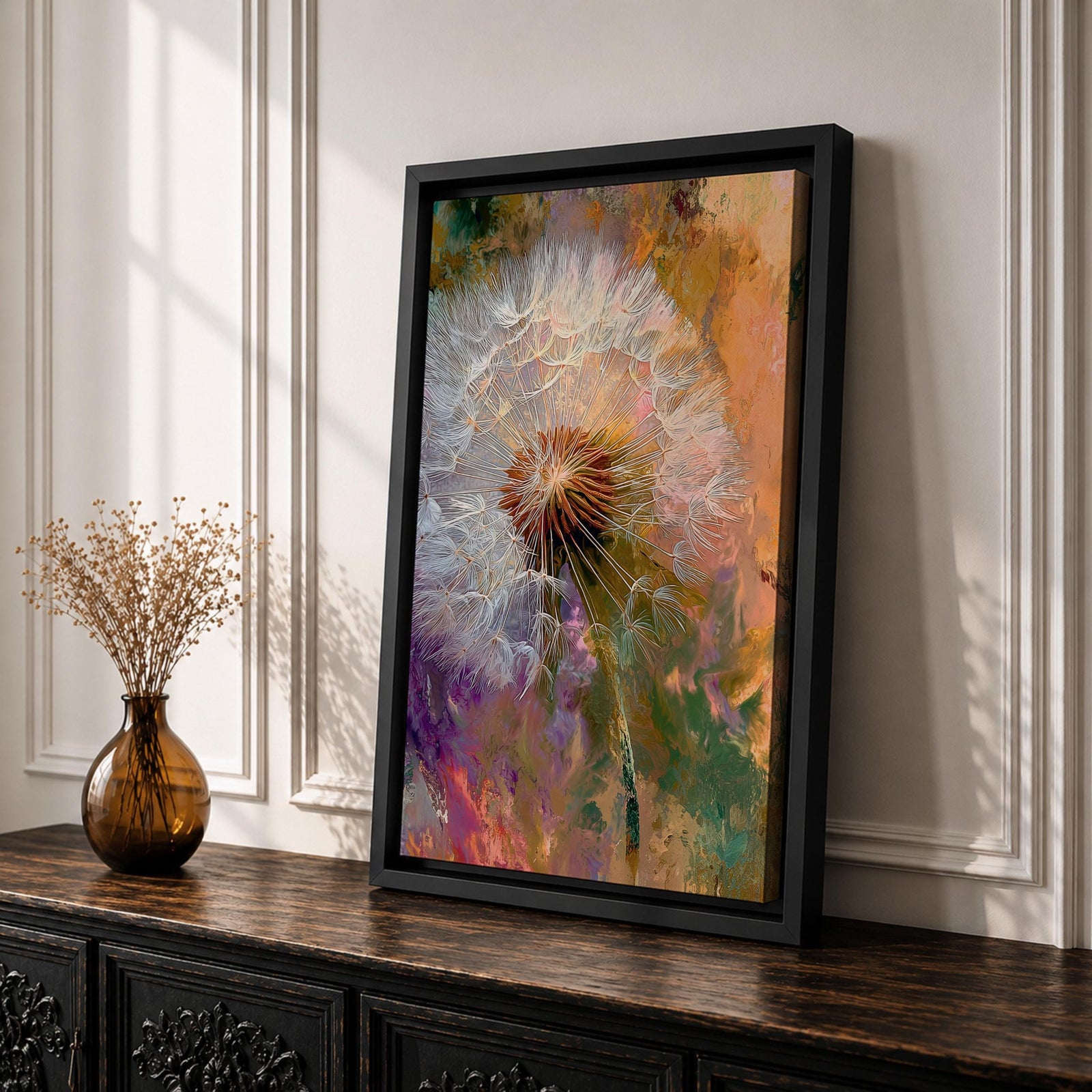 Close-up of a dandelion seed head with fine white filaments against a colorful abstract background featuring warm tones of orange, purple, and green, rendered in an abstract botanical style on a framed canvas.